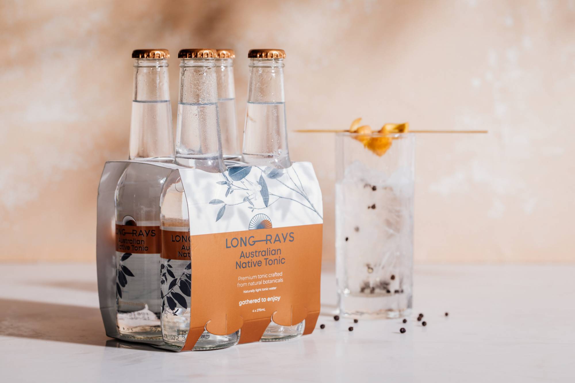 Long Rays Native Tonic bottles and packaging design with brand icon.